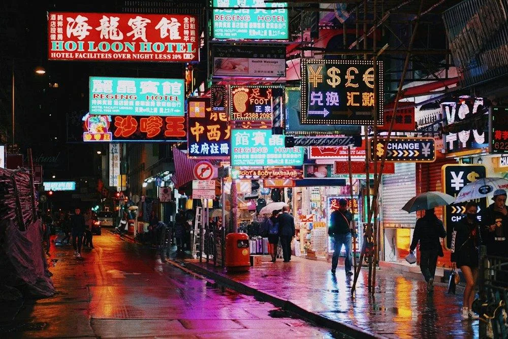 Wet streets under neon signs