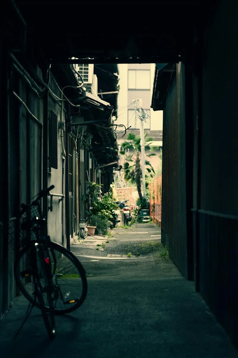 A bicycle in a shaded passage