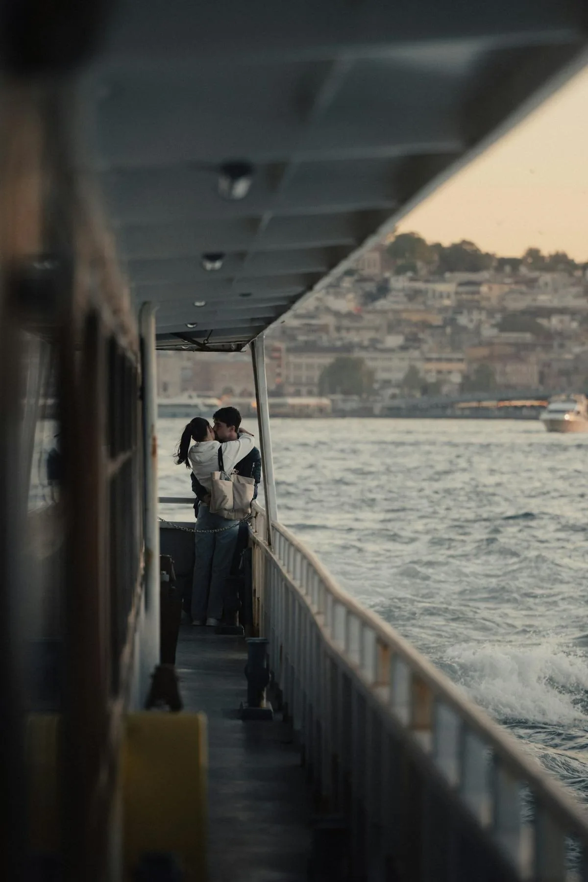 A couple at the rail of a ferry